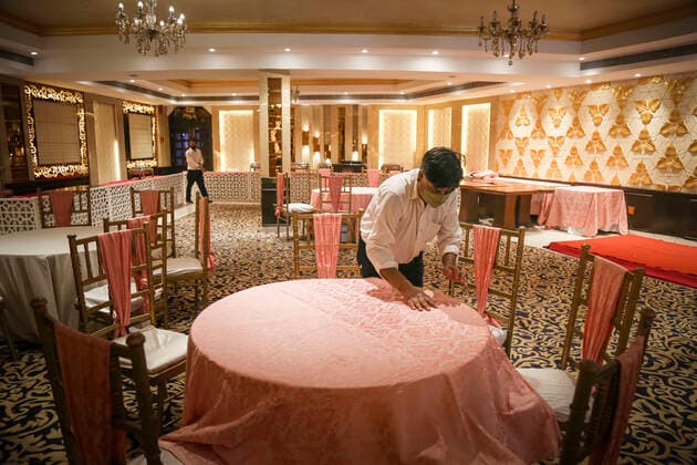 NEW DELHI, INDIA JUNE 27: Preparations underway at Pancshila Rendezvous Banquets in Malviya Nagar ahead of its reopening tomorrow, on June 27, 2021 in New Delhi, India. Gyms and yoga centres have been allowed to reopen in Delhi from Monday at 50% capacity, an official government order said. Banquet halls, marriage halls, and hotels have also been permitted to host weddings, but the number of guests has been capped at 50, the order said. (Photo by Sanchit Khanna Hindustan Times ) Delhi Unlock 5: Gyms, Banquet Halls, Hotels To Open From Monday