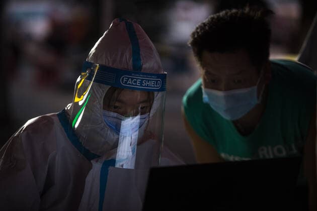 (210803) -- WUHAN, Aug. 3, 2021 -- A resident has her information registered before COVID-19 nucleic acid testing in Wuhan, central China s Hubei Province, Aug. 3, 2021. Wuhan City, capital of central China s Hubei Province, launched another citywide COVID-19 nucleic acid testing campaign on Tuesday, according to a press conference held by the provincial COVID-19 prevention and control headquarters. Wuhan, once hard-hit by COVID-19, identified new local clusters of cases on Monday when seven migrant workers at the Wuhan Economic & Technological Development Zone tested positive for the coronavirus. ) CHINA-HUBEI-WUHAN-COVID-19-TESTING (CN) XiaoxYijiu
