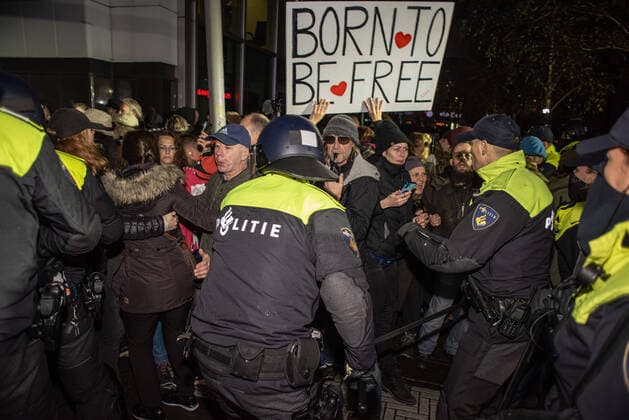 November 2, 2021, The Hague, South Holland, Netherlands: Police clash with protesters during the demonstration..The police arrested thirteen people during an anti-corona demonstration, as new Covid 19 measures were announced by outgoing Dutch Prime Minister, Mark Rutte. A few hundred people gathered outside the ˜Ministry of Justice and Security™ on the Turfmarkt, with the deafening sound of whistles, shouts, music, the banging of cooking pots and drums, and the occasional thrown fire-works and red flares. The Hague Netherlands - ZUMAs197 20211102_zaa_s197_601 Copyright: xCharlesxM.xVellax