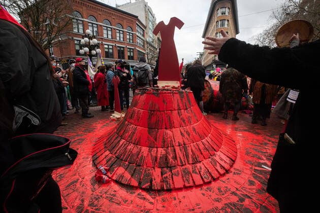 February 14, 2022, VANCOUVER, BC, CANADA: A red dress is placed where the Gassy Jack statue stood after it was toppled and covered in red paint during the annual Women s Memorial March, in Vancouver, on Monday, February 14, 2022. The statue is a monument to Gassy Jack Deighton, a Vancouver saloon owner in the 1860s, whom Vancouver s Gastown neighbourhood is named after. The march is held to honour missing and murdered women and girls from the community with stops along the way to commemorate where women were last seen or found. VANCOUVER CANADA - ZUMAc35_ 20220214_zaf_c35_160 Copyright: xDarrylxDyckx