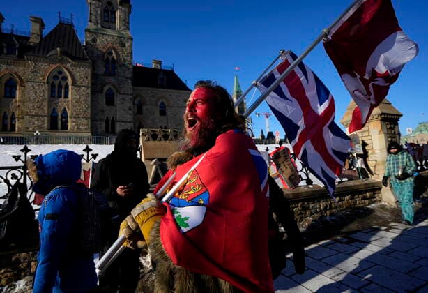 February 14, 2022, Ottawa, ON, CAN: A protester yells öÄufreedomöÄù towards a person who attempted to stick a paper sign on a truck criticizing the so called öÄuFreedom Convoy,öÄù a protest against COVID-19 measures that has grown into a broader anti-government protest, on its 18th day, in Ottawa, on Monday, Feb. 14, 2022. Ottawa CAN - ZUMAc35_ 20220214_zaf_c35_166 Copyright: xJustinxTangx