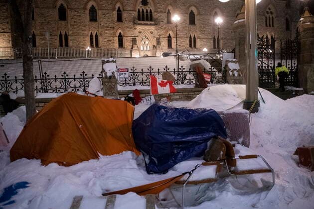 February 19, 2022, Ottawa, ON, Canada: A tent, chairs and other debris lay on the ground in front of Parliament Hill™s West Block after police took action to clear the street of trucks and protesters to end a protest, which started in opposition to mandatory COVID-19 vaccine mandates and grew into a broader anti-government demonstration and occupation, on its 23rd day, in Ottawa, Saturday, Feb. 19, 2022. Ottawa Canada - ZUMAc35_ 20220219_zaf_c35_240 Copyright: xJustinxTangx