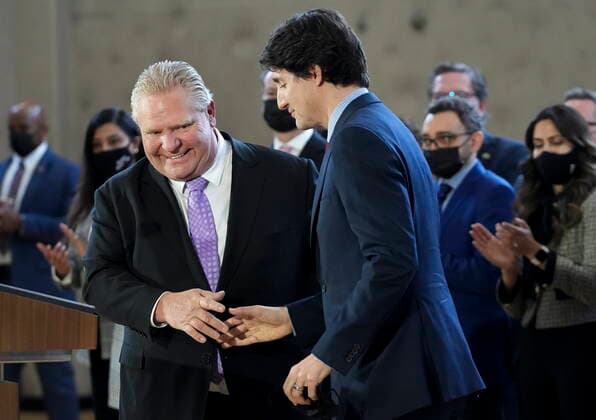March 28, 2022, BRAMPTON, ON, CANADA: Prime Minister Justin Trudeau, right, shakes hands with Ontario Premier Doug Ford after reaching and agreement in $10-a-day child-care program deal in Brampton, Ont., on Monday, March 28, 2022. BRAMPTON CANADA - ZUMAc35_ 20220328_zaf_c35_020 Copyright: xNathanxDenettex