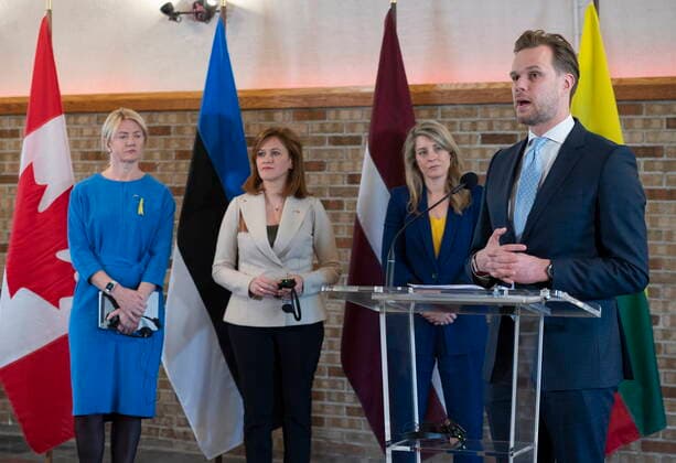 June 2, 2022, QUEBEC, PQ, Canada: Minister of Foreign Affairs of the Republic of Lithuania Gabrielius Landsbergis speaks at a news conference as he meets Melanie Joly, behind, Minister of Foreign Affairs and her counterparts from the Baltic region, Minister of Foreign Affairs of the Republic of Estonia Eva-Maria Liimets, left, and Zanda Kalnina-Lukasevica, centre, of LatviaöÄö Parliamentary Secretary of the Ministry of Foreign Affairs, Thursday, June 2, 2022 in Quebec City. QUEBEC Canada - ZUMAc35_ 20220602_zaf_c35_054 Copyright: xJacquesxBoissinotx