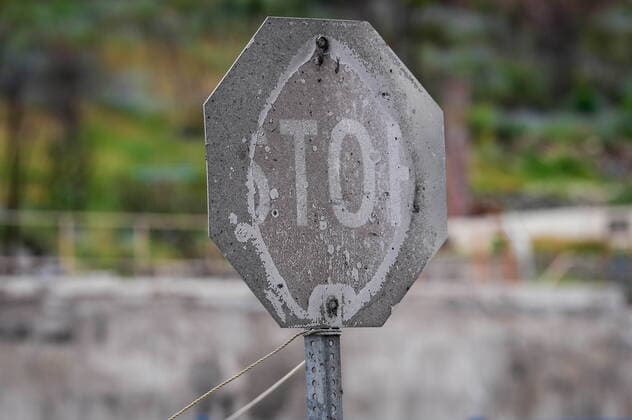 June 14, 2022, LYTTON, BC, CANADA: A stop sign that was burned by wildfire is seen, in Lytton, B.C., on Tuesday, June 14, 2022. The fire-ravaged community of Lytton, B.C., will get $77 million from the federal government to help it rebuild a fire-resistant and energy-efficient community. Two people were killed and much of the centre of the village was destroyed when wildfire ripped through the community almost a year ago. LYTTON CANADA - ZUMAc35_ 20220614_zaf_c35_094 Copyright: xDarrylxDyckx