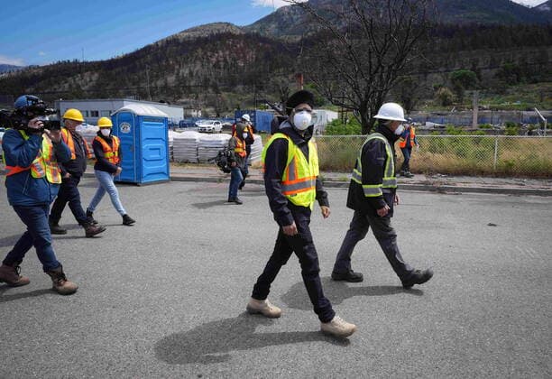 June 14, 2022, LYTTON, BC, CANADA: Harjit Sajjan, centre, minister of International Development, views wildfire damage with Owen Collings, right, a resident who works as site support for the village, in Lytton, B.C., on Tuesday, June 14, 2022. The fire-ravaged community of Lytton, B.C., will get $77 million from the federal government to help it rebuild a fire-resistant and energy-efficient community. Two people were killed and much of the centre of the village was destroyed when wildfire ripped through the community almost a year ago. LYTTON CANADA - ZUMAc35_ 20220614_zaf_c35_072 Copyright: xDarrylxDyckx