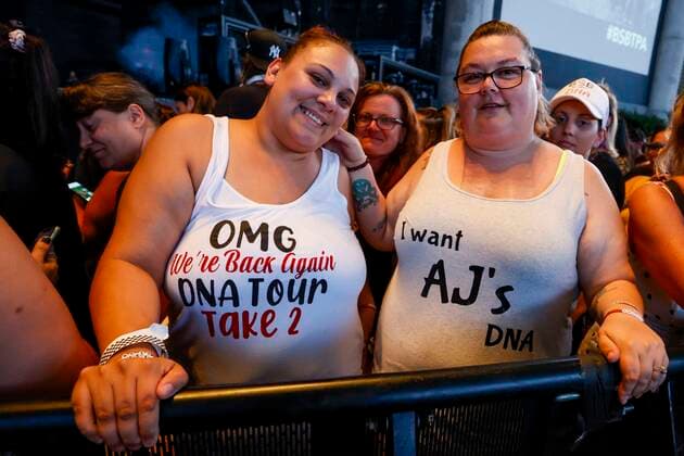 June 21, 2022, Tampa, Florida, USA: Jessica Quintero, 35, left and Melissa Martel, 41, right, of New Port Richey, pose for a picture while waiting to see the Backstreet Boys perform at the MidFlorida Credit Union Amphitheatre in Tampa on Tuesday, June 21, 2022. â€oeIâ€⠢m married and have kids and this is my happy place,†Martel said of being at a concert. Quintero said she used to make Brian Littrell, of the Backstreet Boys, a birthday cake in the 90s because they share a birthday month. Tampa USA - ZUMAs70_ 20220621_zan_s70_090 Copyright: xIvyxCeballox