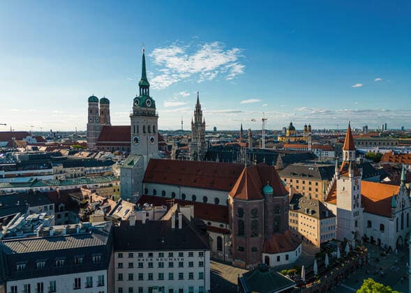 Old Town Towers in the Center of Munich, Germany Alter Peter, Frauenkirche and Town Hall Tower at Marienplatz with blue sky in summer Munich Germany