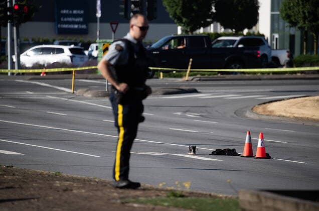 July 25, 2022, LANGLEY, BC, CANADA: An RCMP officer stands near a shoe with blood on it and other belongings on the road at the scene of a shooting, in Langley, B.C., on Monday, July 25, 2022. A suspect is in custody after several people were shot in the Metro Vancouver city of Langley, RCMP said. Police issued a blaring cellphone alert at about 6:20 Monday morning, saying they were at the scenes of several shootings involving transient victims. LANGLEY CANADA - ZUMAc35_ 20220725_zaf_c35_109 Copyright: xDarrylxDyckx