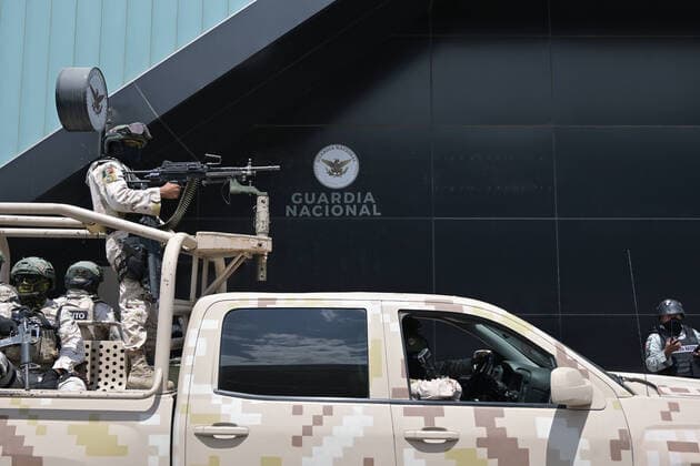 August 13, 2022, Tijuana, Baja California, Mexico: A convoy of three hundred military troops joined the elements of Mexicoâ€⠢s National Guard at the Tijuana International Airport, a stone throw away from the U.S-Mexico border on Saturday, August 13, 2022, in response to Fridayâ€⠢s simultaneous attacks on public transit and vehicles from armed crime organizations all over Baja California, 24 burned vehicles in the entire state, 15 in Tijuana alone. No deaths or victims were reported...So far, 17 suspects have been arrested for the violent acts recorded yesterday in Tijuana, Mexicali, Ensenada and Rosarito. Tijuana Mexico - ZUMAm180 20220813_zip_m180_002 Copyright: xCarlosxA.xMorenox