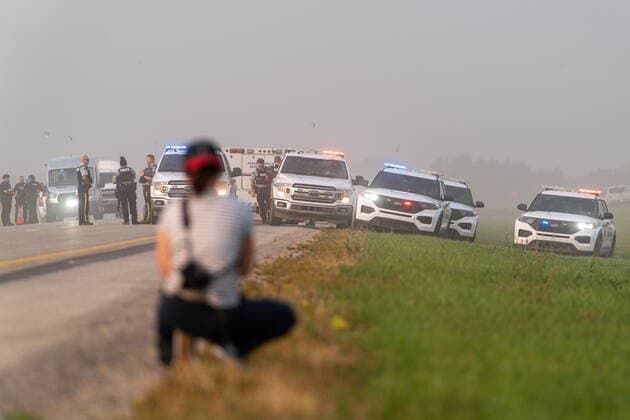 September 7, 2022, Rosthern, SK, Canada: Police and investigators are seen at the side of the road outside Rosthern, Sask., on Wednesday, Sept. 7, 2022. RCMP say Myles Sanderson, a suspect in a deadly stabbing rampage northeast of Saskatoon over the weekend, has been taken into custody near the town of Rosthern on the fourth day of a massive manhunt. Rosthern Canada - ZUMAc35_ 20220907_zaf_c35_138 Copyright: xHeywoodxYux