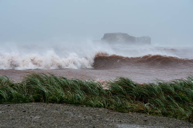 September 24, 2022, Žles-de-la-Madeleine, Que, CANADA: Waves coming ashore at l Etang-du-Nord caused by post-tropical storm Fiona are shown on the Les ÃŽles-de-la-Madeleine, Que., Saturday, Sept. 24, 2022. Coastal flooding remains a threat for parts of Nova Scotia, Prince Edward Island including the Northumberland Strait, the Gulf of St. Lawrence region including Iles-de-la-Madeleine and eastern New Brunswick, southwest Newfoundland, the St. Lawrence Estuary and the Quebec Lower North Shore. Îles-de-la-Madeleine CANADA - ZUMAc35_ 20220924_zaf_c35_066 Copyright: xNigelxQuinnx