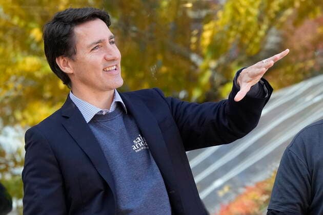 October 14, 2022, Kitchener, ON, CANADA: Prime Minister Justin Trudeau looks at a solar installation, which can be seen in a reflection in the background, during a tour of Reep Green Solutions in Kitchener, Ont., Friday, Oct. 14, 2022. Kitchener CANADA - ZUMAc35_ 20221014_zaf_c35_053 Copyright: xFrankxGunnx