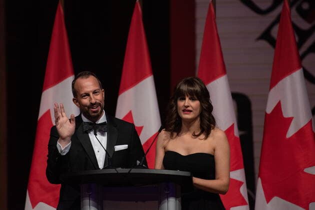 October 22, 2022, Gatineau, PQ, Canada: Mike Le Couteur, left, and Marie Vastel deliver remarks as MCs during the Parliamentary Press Gallery Dinner at the Museum of History in Gatineau, Que., on Saturday, Oct. 22, 2022. Gatineau Canada - ZUMAc35_ 20221022_zaf_c35_035 Copyright: xSpencerxColbyx