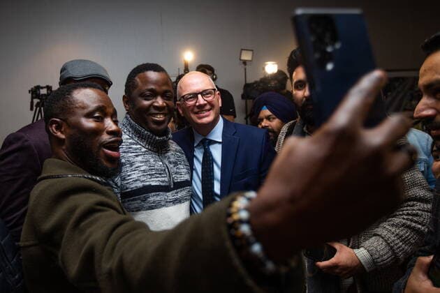 October 26, 2022, Winnipeg, MB, Canada: Ayodele Odeyemi, left, and supporters take a selfie with Scott Gillingham as people celebrate in Winnipeg, on Wednesday, October 26, 2022, following Gillingham™s win in the city™s mayoral election. Winnipeg Canada - ZUMAc35_ 20221026_zaf_c35_164 Copyright: xDanielxCrumpx