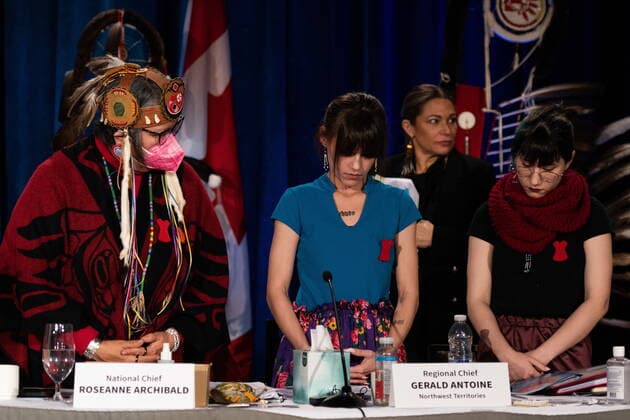 December 7, 2022, Ottawa, ON, Canada: Assembly of First Nations (AFN) National Chief, RoseAnne Archibald, left, stands as Cambria Harris, centre, and Kera Harris receive a standing ovation following their respective speeches in honour of their mother, Morgan Harris, who was killed by an alleged serial killer in Winnipeg, but her body has not yet been found in Ottawa, on Wednesday, Dec. 7, 2022. Ottawa Canada - ZUMAc35_ 20221207_zaf_c35_132 Copyright: xSpencerxColbyx