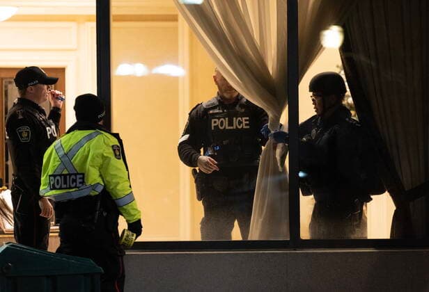 December 18, 2022, Vaughan, ON, CANADA: Police are seen in the lobby of a condo building following a shooting in Vaughan, Ont., Sunday, Dec. 18, 2022. Police say multiple people are dead, including the suspect, after a shooting in an apartment building. Vaughan CANADA - ZUMAc35_ 20221218_zaf_c35_100 Copyright: xArlynxMcadoreyx
