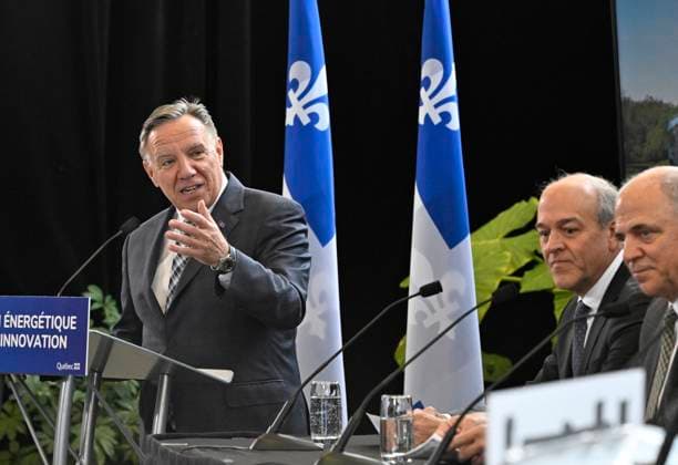 February 2, 2023, QUEBEC, PQ, Canada: Quebec Premier Francois Legault announces the implantation of a green hydrogen train in the Charlevoix region, Thursday, February 2, 2023, in Quebec City. Groupe Le Massif Claude Choquette, centre, and Quebec Economy and Innovation Minister Pierre Fitzgibbon, right, look on. QUEBEC Canada - ZUMAc35_ 20230202_zaf_c35_033 Copyright: xJacquesxBoissinotx