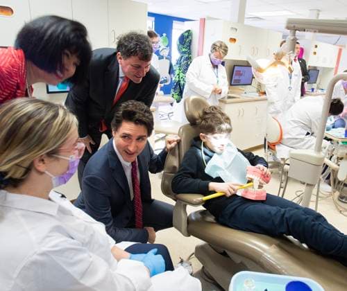 March 31, 2023, Moncton, NB, Canada: Prime Minister Justin Trudeau, centre, Minister Dominic LeBlanc, Intergovernmental Affairs, Infrastructure and Communities and Minister Ginette Petitpas Taylor, Official Languages and Minister responsible for the Atlantic Canada Opportunities Agency, speaks with dental hygienist students and patients at Oulton College in Moncton, N.B., on Friday, March 31, 2023. Moncton Canada - ZUMAc35_ 20230331_zaf_c35_063 Copyright: xRonxWardx