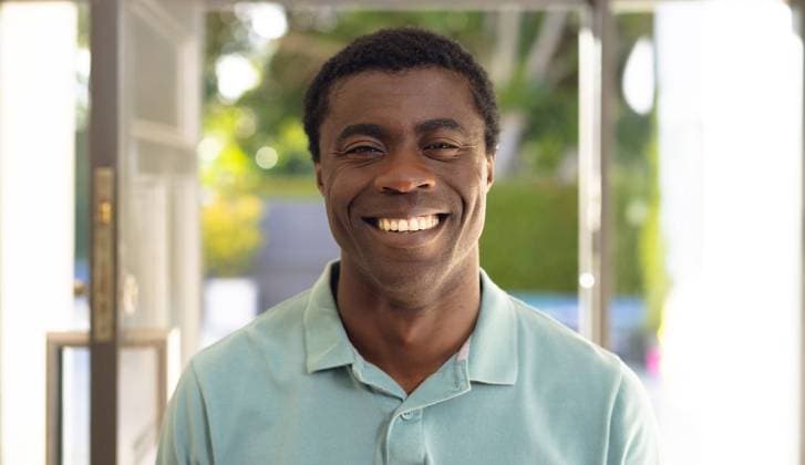 Portrait of happy african american man looking at camera and smiling Portrait of happy african american man looking at camera and smiling. Spending quality time at home alone., model released, , property released, Cape Town, South Africa, 21.09.2022, 3839332.jpg, people,portrait,happy,african american,man,looking camera,smiling,spending,quality time,home,alone,young,person,cheerful,adult,lifestyle,attractive,smile,cute,happiness,face,pretty,fun,looking,casual,beautiful,indoors,sitting,kid,house,african,american,camera,quality,time Mid Adult,Man,Male,Black
