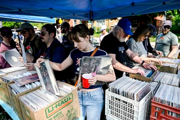 May 27, 2023, Ottawa, ON, CAN: People search through boxes of records at the Great Glebe Garage Sale, in Ottawa, on Saturday, May 27, 2023. The community event draws thousands of people to the Glebe, one of OttawaöÄÃ s heritage neighbourhoods, with vendors donating a percentage proceeds to the Ottawa Food Bank. Ottawa CAN - ZUMAc35_ 20230527_zaf_c35_017 Copyright: xJustinxTangx
