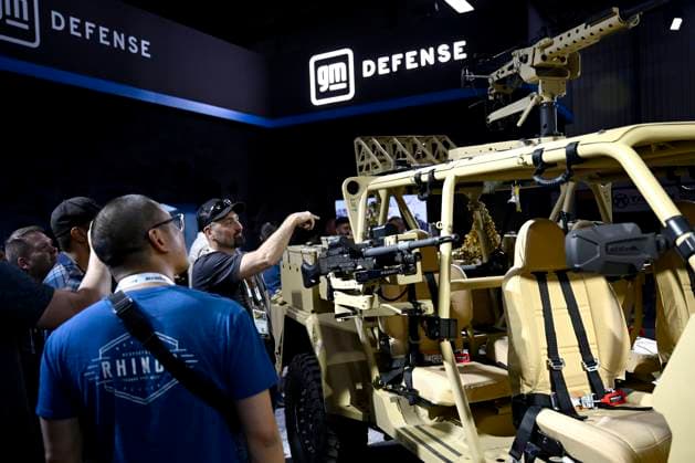 May 31, 2023, Ottawa, ON, CAN: Attendees look at a GM Infantry Squad Vehicle with a heavy gun carrier kit, at the CANSEC trade show, billed as North AmericaöÄÃ s largest multi-service defence event, in Ottawa, on Wednesday, May 31, 2023. Ottawa CAN - ZUMAc35_ 20230531_zaf_c35_039 Copyright: xJustinxTangx