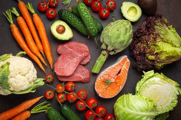 Assorted food raw products: vegetables, beef meat, fish salmon fillet on dark rustic brown stone table top view. Healthy food background, ingredients with vitamins concept, diet and nutrition Assorted food raw products: vegetables, beef meat steak, fish salmon fillet on dark rustic brown stone table top view. Healthy food background, ingredients with vitamins concept, diet and nutrition Copyright: xZoonar.com OlenaxYeromenkox 20190631