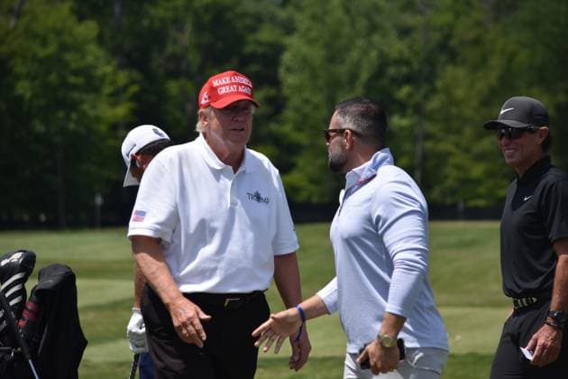 May 27, 2023, Sterling, Virginia, United States: Former President of the United States Donald J. Trump visits the driving range and speaks with fans. Former President of the United States Donald J. Trump visits the driving range, meets fans and watches LIV Golf Washington DC 2023 Round 2 at Trump National Golf Club Washington DC in Sterling, Virginia, United States. Sterling United States - ZUMAs197 20230527_zaa_s197_135 Copyright: xKylexMazzax