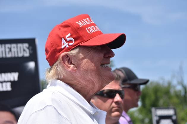 May 27, 2023, Sterling, Virginia, United States: Former President of the United States Donald J. Trump takes photos, signs objects as he visits the driving range. Former President of the United States Donald J. Trump visits the driving range, meets fans and watches LIV Golf Washington DC 2023 Round 2 at Trump National Golf Club Washington DC in Sterling, Virginia, United States. Sterling United States - ZUMAs197 20230527_zaa_s197_145 Copyright: xKylexMazzax