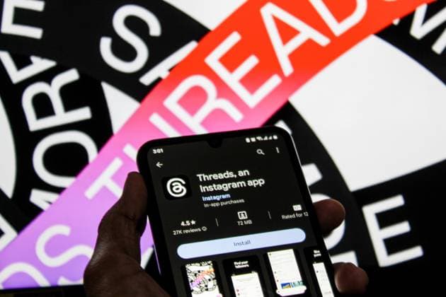 July 7, 2023, Bandung, West Java, Indonesia: In this photo illustration, Threads logo seen displayed on a smartphone and a threads logo in the background. Threads is the new social network from Meta Platforms which was launched on the 5th of July 2023. According to Meta CEO Mark Zuckerberg, the Threads app is designed to rival Twitter. As of 6th of July 2023, the Thread app already has 10 million users. Bandung Indonesia - ZUMAs281 20230707_zip_s281_016 Copyright: xAlgixFebrixSugitax