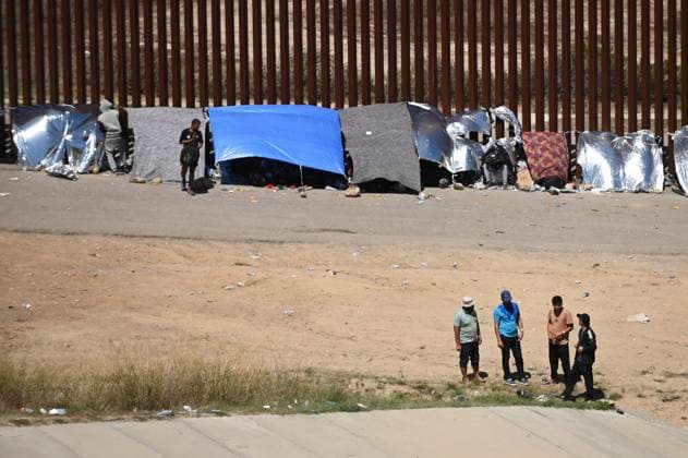 September 12, 2023, Tijuana, Baja California, Mexico: Around a hundred people are stuck between the two US-Mexico border fences dividing Tijuana and San Diego on Tuesday, September 12, 2023, as viewed from Tijuana, Mexico. The migrants are from countries in South America, Central Asia, Eastern Europe and Africa. All are seeking a chance to enter the US via asylum status, as some lost patience in the process of getting appointments through the CBP One application and crossed illegally out of desperation, some waiting months. Migrants claim that the appointment system is over saturated and is difficult to obtain access on the phone app. Tijuana Mexico - ZUMAm180 20230912_zip_m180_007 Copyright: xCarlosxA.xMorenox