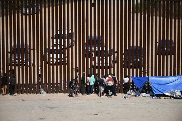 September 12, 2023, Tijuana, Baja California, Mexico: Around a hundred people are stuck between the two US-Mexico border fences dividing Tijuana and San Diego on Tuesday, September 12, 2023, as viewed from Tijuana, Mexico. US officials along the border with Mexico processed 183,000 plus migrants this July, as illegal crossings jumped by 33 percent after dropping to a two-year low in June, a month after the Title 42 migrant policy rescinded on May 12, despite record high heat levels, according to government statistics. Tijuana Mexico - ZUMAm180 20230912_zip_m180_013 Copyright: xCarlosxA.xMorenox