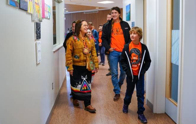September 30, 2023, La Ronge, SK, Canada: Lac La Ronge Indian Band Chief Tammy Cook-Searson, left to right, Prime Minister Justin Trudeau, and his son Hadrien walk during a tour of Woodland Wellness Centre on National Day for Truth and Reconciliation in La Ronge, Sask., Saturday, Sept. 30, 2023. La Ronge Canada - ZUMAc35_ 20230930_zaf_c35_120 Copyright: xHeywoodxYux