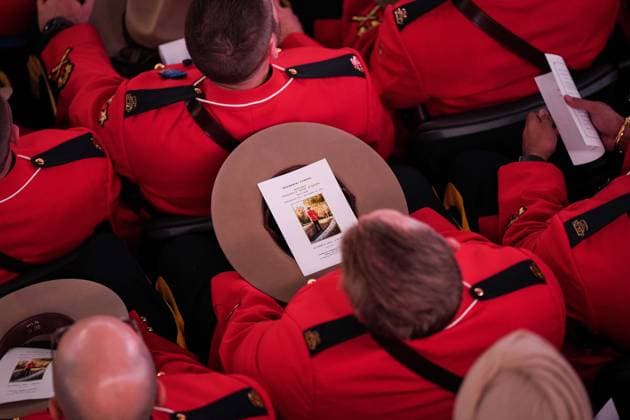 October 4, 2023, LANGLEY, BC, CANADA: A photograph of RCMP Const. Rick O Brien is seen on a program in a stetson as RCMP officers listen during a regimental funeral for him in Langley, B.C., on Wednesday, October 4, 2023. O Brien, 51, was killed last month while executing a search warrant at a home in Coquitlam. LANGLEY CANADA - ZUMAc35_ 20231004_zaf_c35_103 Copyright: xDarrylxDyckx