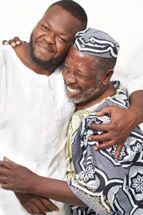 African American father and son hugging Miami, FL, 21.12.2023, model released, TTBB_BLD080106.jpg, adult child, 30-34 years, 55-59 years, affection, african ethnicity, bonding, celebration, cheek to cheek, color image, devotion, family, family with one child, father, front view, grinning, happy, hat, hugging, kwanzaa, looking at camera, love, man, mature adult, mid adult, one parent, people, photography, portrait, posing, side view, smiling, son, standing, studio shot, together, tradition, traditional clothing, two people, vertical, waist up, white background, minority, minorities2, 30s, 30-35, 30-40, 30s, 35-40, 40s, 40-45, 40-50, 40s, 45-50, 50-55, 50-60, 55-60, accessory, adoring, adult, affectionate, african, african american, african- Copyright: xRolfxBrudererx