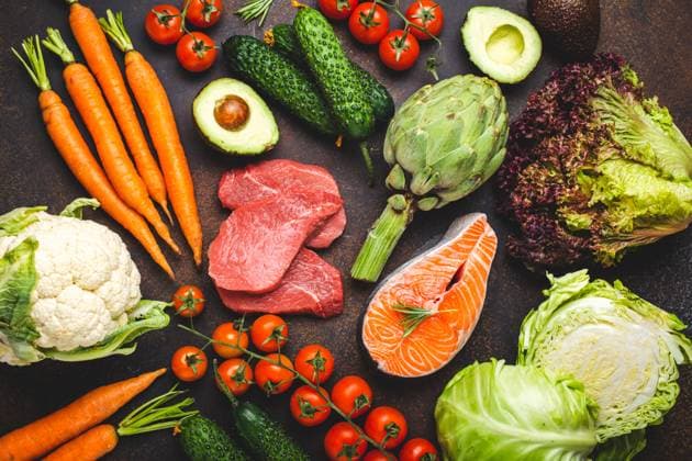 Assorted food raw products: vegetables, beef meat, fish salmon fillet on dark rustic brown stone table top view. Healthy food background, ingredients with vitamins concept, diet and nutrition Assorted food raw products: vegetables, beef meat steak, fish salmon fillet on dark rustic brown stone table top view. Healthy food background, ingredients with vitamins concept, diet and nutrition Copyright: xZoonar.com OlenaxYeromenkox 20929841