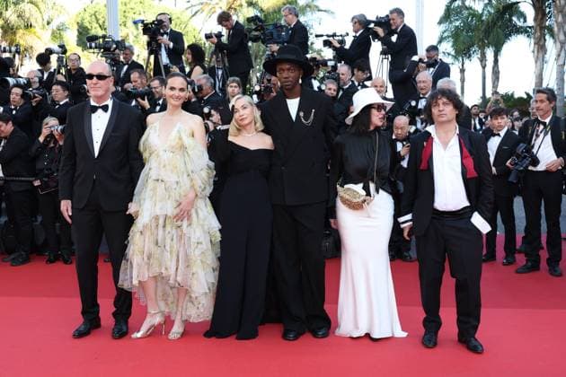 Cannes - Closing Ceremony Arrivals Members of the Camera d Or jury French deputy general manager HR and support TSF cinema Pascal Buron, Belgian director, screenwriter Zoe Wittock, French actress, director, producer and President of the Camera d Or jury Emmanuelle Beart, Congolese and Belgian director, songwriter, artistic director and President of the Camera d Or jury Baloji, French cinema section head ebra, treasurer sfcc Nathalie Chifflet and French director of photography Gilles Porte arrive for the Closing Ceremony of the 77th edition of the Cannes Film Festival in Cannes, southern France, on May 25, 2024. Photo by Shootpix ABACAPRESS.COM Cannes France Copyright: xShootpix ABACAx