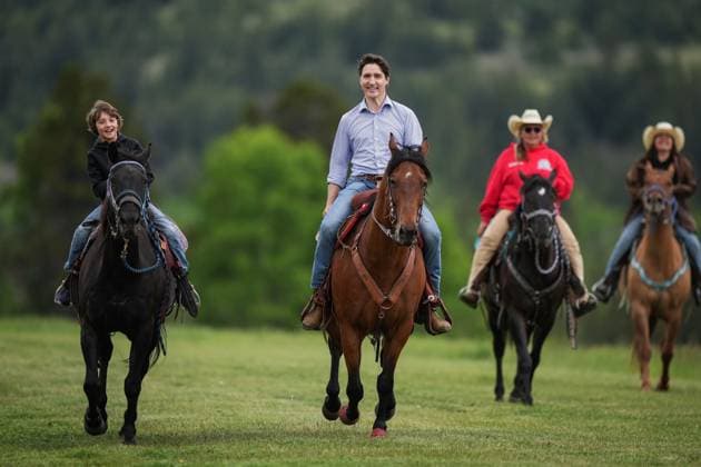 June 26, 2024, Nemaiah Valley, Bc, CANADA: Prime Minister Justin Trudeau and his son Hadrien, 10, ride horses while attending community celebrations to mark the 10th anniversary of the Tsilhqot in decision, in Nemaiah Valley, B.C., on Wednesday, June 26, 2024. In 2014, the Supreme Court of Canada granted Tsilhqot in aboriginal title to more than 1,750 square kilometres of land in the Nemaiah Valley. Nemaiah Valley CANADA - ZUMAc35_ 20240626_zaf_c35_135 Copyright: xDarrylxDyckx