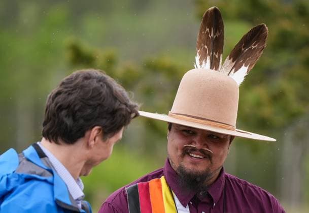 June 26, 2024, Nemaiah Valley, Bc, CANADA: Peyal Lacesse, right, listens to Prime Minister Justin Trudeau after presenting his son Hadrien, 10, with gloves that were made by his mother, during community celebrations to mark the 10th anniversary of the Tsilhqot in decision, in Nemaiah Valley, B.C., on Wednesday, June 26, 2024. In 2014, the Supreme Court of Canada granted Tsilhqot in aboriginal title to more than 1,750 square kilometres of land in the Nemaiah Valley. Nemaiah Valley CANADA - ZUMAc35_ 20240626_zaf_c35_149 Copyright: xDarrylxDyckx