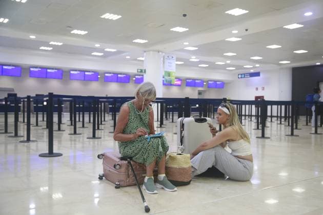 (240705) -- CANCUN (MEXICO), July 5, 2024 -- Travelers wait inside the Cancun International Airport after the arrival of Hurricane Beryl, in Cancun, Quintana Roo state, Mexico, on July 5, 2024. Over 1 million people in the Caribbean have been affected by Hurricane Beryl, UN humanitarians said Friday. As a category 4 hurricane that has claimed at least 11 lives so far, Beryl left a trail of destruction in Grenada and Saint Vincent and the Grenadines on Monday, then impacting Jamaica on Wednesday. The hurricane is currently affecting Belize and Mexico. (Photo by Xinhua) MEXICO-CANCUN-HURRICANE BERYL AlbertoxValdez