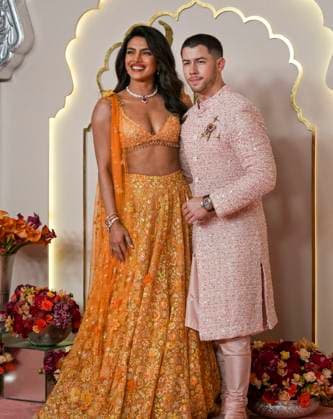 Anant Ambani-Radhika Merchant s wedding Mumbai: Actor Priyanka Chopra with her husband and singer Nick Jonas poses for photographs upon her arrival to attend Anant Ambani and Radhika Merchant s wedding, in Mumbai, Friday, July 12, 2024. (PTI Photo Kunal Patil)(PTI07_12_2024_000263B) Mumbai Maharashtra India Copyright: x-x (PTI07_12_2024_000263B)