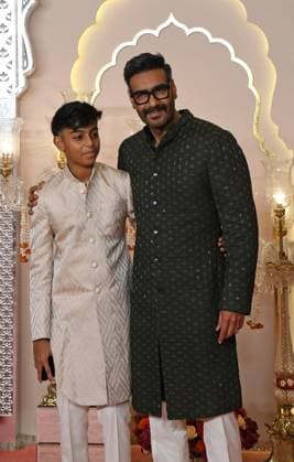 Wedding red carpet of Anant Ambani & Radhika Merchant in Mumbai, India - 12 Jul 2024 Bollywood actor Ajay Devgn pose for a photo with his son Yug Devgn (L) on the red carpet wedding ceremony of Anant Ambani and Radhika Merchant in Mumbai. Mumbai India Copyright: xAshishxVaishnavx xSOPAxImagesx AVaishnav_Wedding red carpet of Anant Ambani _ Radhika Merchant in Mumbai, India (38)