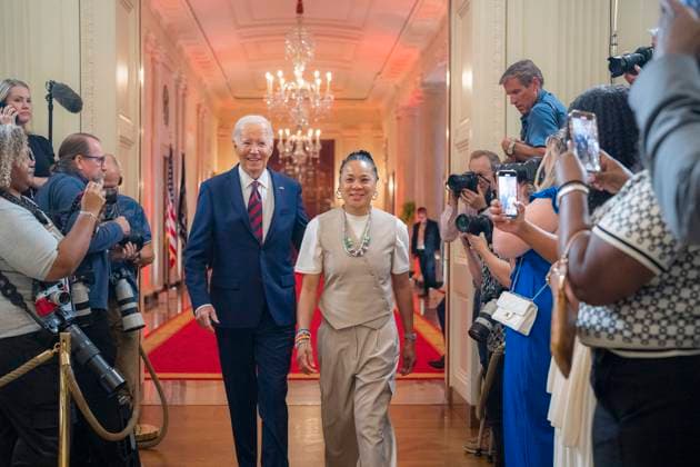September 10, 2024, Washington, Dc, United States of America: U.S President Joe Biden, left, arrives with the University of South Carolina NCAA Womenâ€⠢s basketball champions coach Dawn Staley, right, at East Room of the White House, September 10, 2024 in Washington, D.C. Washington United States of America - ZUMAp138 20240910_zaa_p138_026 Copyright: xOliverxContreras WhitexHousex