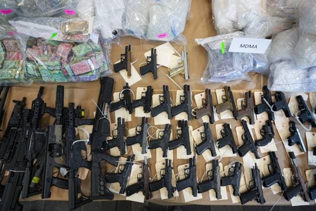 October 31, 2024, Surrey, Bc, CANADA: Firearms, illicit drugs and cash that were seized last week are displayed before a news conference at RCMP headquarters, in Surrey, B.C., on Thursday, October 31, 2024. The RCMP says they have dismantled the largest and most sophisticated fentanyl and methamphetamine drug superlab in Canada, after an operation was conducted in Falkland, B.C., and Surrey beginning last Friday. Surrey CANADA - ZUMAc35_ 20241031_zaf_c35_092 Copyright: xDarrylxDyckx