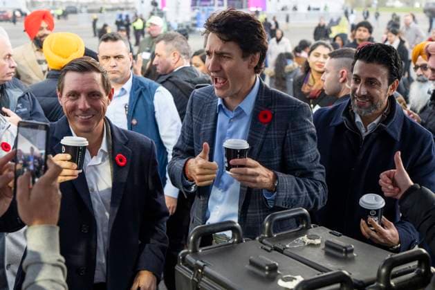 November 1, 2024, Brampton, On, CANADA: Mayor Patrick Brown, left, Prime Minister Justin Trudeau, middle, and Liberal Member of Parliament for Brampton East Maninder Sidhu react after taking a sip of chai from Chaiiwala of London at the Diwali Mela festival at Sesquicentennial Park in Brampton, Ont., Friday, Nov. 1, 2024. Brampton CANADA - ZUMAc35_ 20241101_zaf_c35_068 Copyright: xAndrewxLahodynskyjx