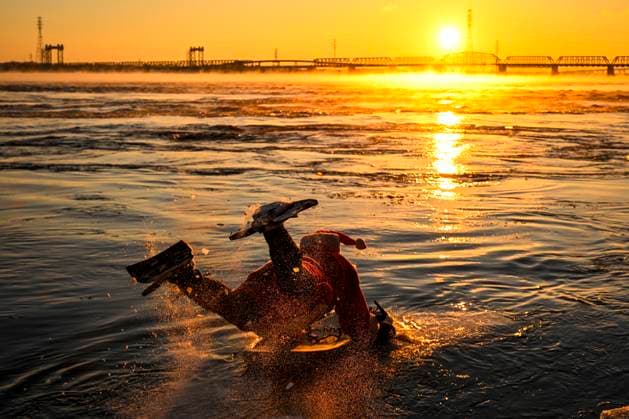 December 25, 2024, Montreal, Pq, Canada: Carlos Hebert Plante, who boogie boards daily, dressed as Santa Claus to hit the water amid an air temperature of -14 degrees Celsius on Christmas Day, in Montreal, Wednesday, Dec. 25, 2024. The standing wave on the St-Lawrence River is close to downtown Montreal and itöÄÃ s a popular spot for surfers. Montreal Canada - ZUMAc35_ 20241225_zaf_c35_029 Copyright: xBernardxBraultx