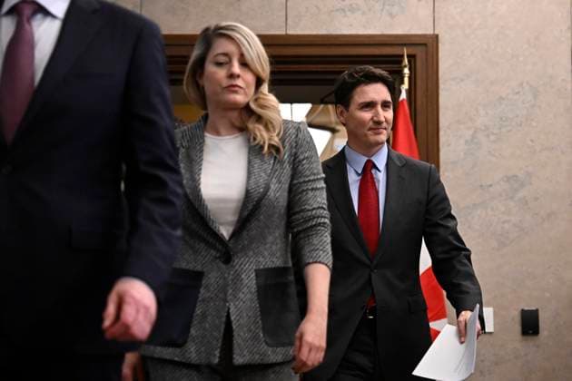 February 1, 2025, Ottawa, On, CANADA: Prime Minister Justin Trudeau arrives alongside cabinet members, including Global Affairs Minister Melanie Joly, to address media following the imposition of a raft of tariffs by U.S. President Donald Trump against Canada, Mexico and China, in Ottawa, Saturday, Feb. 1, 2025. Ottawa Canada - ZUMAc35_ 20250201_zaf_c35_128 Copyright: xJustinxTangx