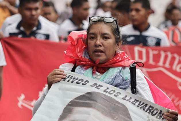 March 26, 2025, Mexico City, Cdmx, Mexico: Mothers, fathers, relatives, and classmates of the 43 students from Ayotzinapa, Guerrero, demonstrate on Paseo de la Reforma Avenue to demand that the government of Claudia Sheinbaum resolve the forced disappearance of the students, which occurred 10 years ago; the Mexican Army, the municipal police, and organized crime are being blamed for this incident. Mexico City Mexico - ZUMAp204 20250326_zip_p204_034 Copyright: xJosuexPerezx