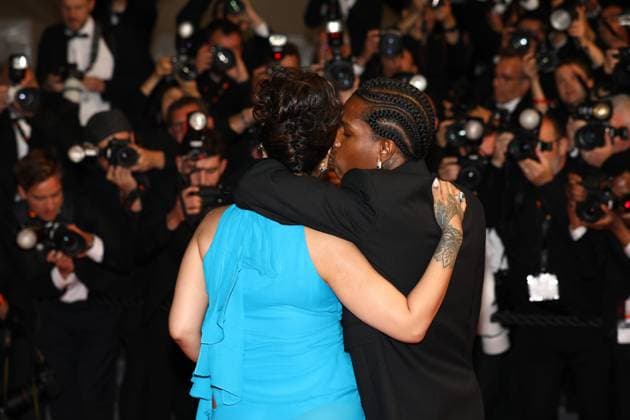 May 19, 2025, Cannes, France: A$AP ROCKY, 36, on the rainy carpet cradling his boo RIHANNA, 37, belly, with his chin resting on her shoulder on the La montà e des marches . Pregnant Barbadian Billionaire singer, actress, and businesswoman, showed off her growing baby bump in an electric-blue dress with strategic cutouts and a scarf tie at the neck and her styling partner American rapper wearing a black suit, black Ray-Bans and a full set of grillz to the premiere of the Spike directed film Premiere of Highest 2 Lowest , in which he co-stars opposite Denzel. Monday 7th day of the 78th Annual Cannes Film Festival on the LE RED STEPS. Cannes France - ZUMAc179 20250519_zep_c179_373 Copyright: xMickaelxChavetx