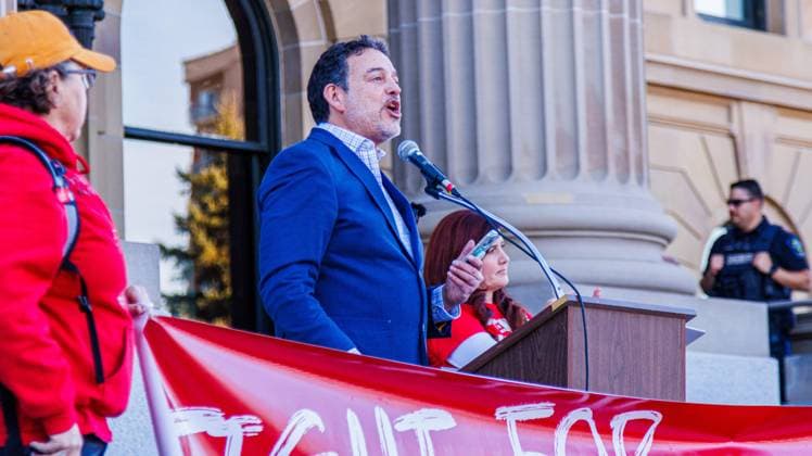 October 23, 2025, Edmonton, Alberta, Canada: Gil McGowan, president of the Alberta Federation of Labour addresses the crowd during the demonstration. Over 20,000 people with various signs speaking out about the state of education under the current Premier Danielle Smith, rallied outside the Alberta Legislature as the Throne Speech was being read in the legislature. Teachers have been on strike since October 7th and have rejected 2 offers from the Province. The Main Issues are Class Sizes, Educational Assistant Support, and wages. Teachers made an offer to the province, which has not been responded to. The Province is expected to introduce back to work legislation Monday. Edmonton Canada - ZUMAs197 20251023_aaa_s197_357 Copyright: xRonxPalmerx
